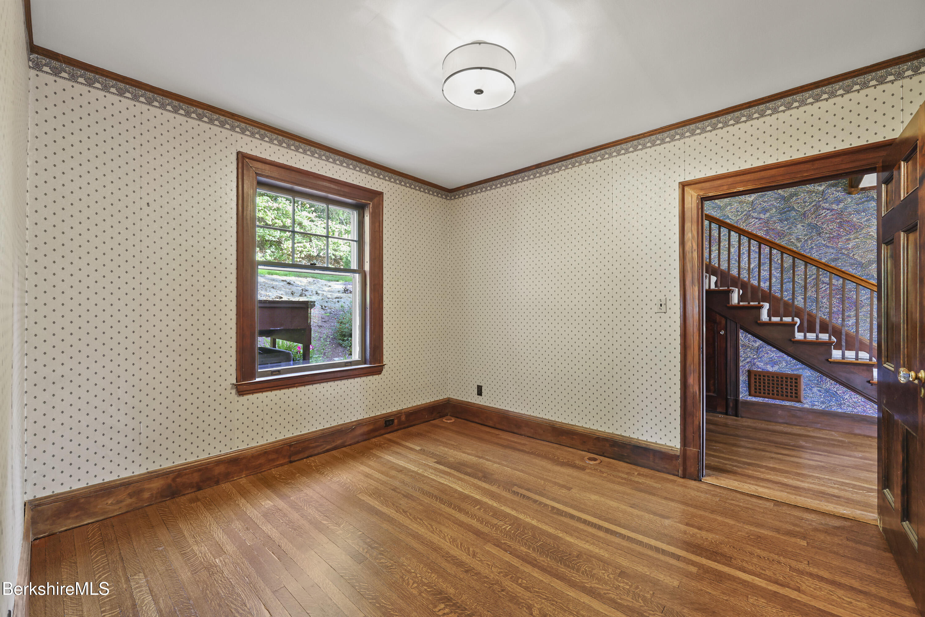 5 Crofut Street Pittsfield, MA 01201 - Photo 21 of 63 a view of an empty room with wooden floor and a window