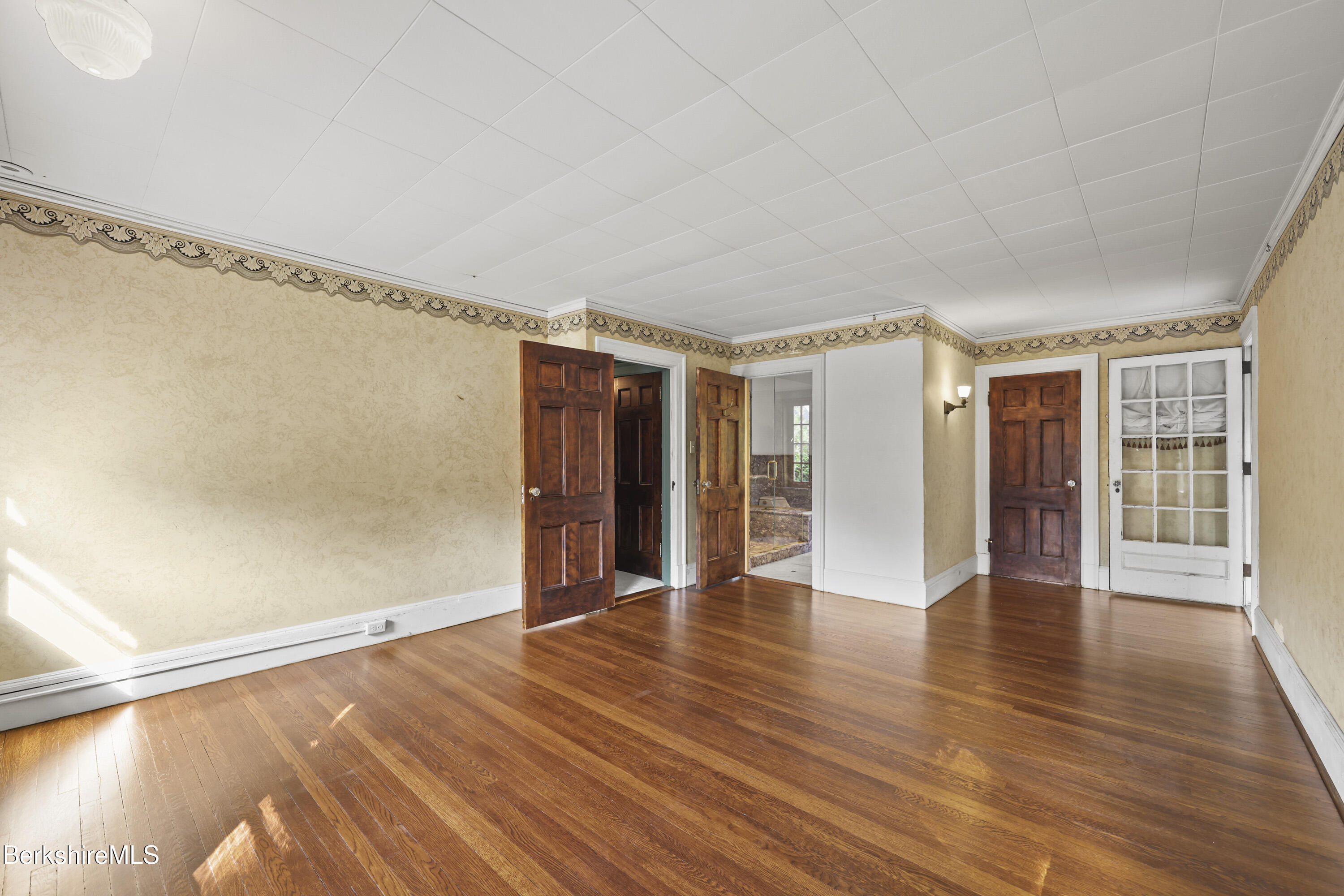 5 Crofut Street Pittsfield, MA 01201 - Photo 27 of 63 a view of an empty room with wooden floor