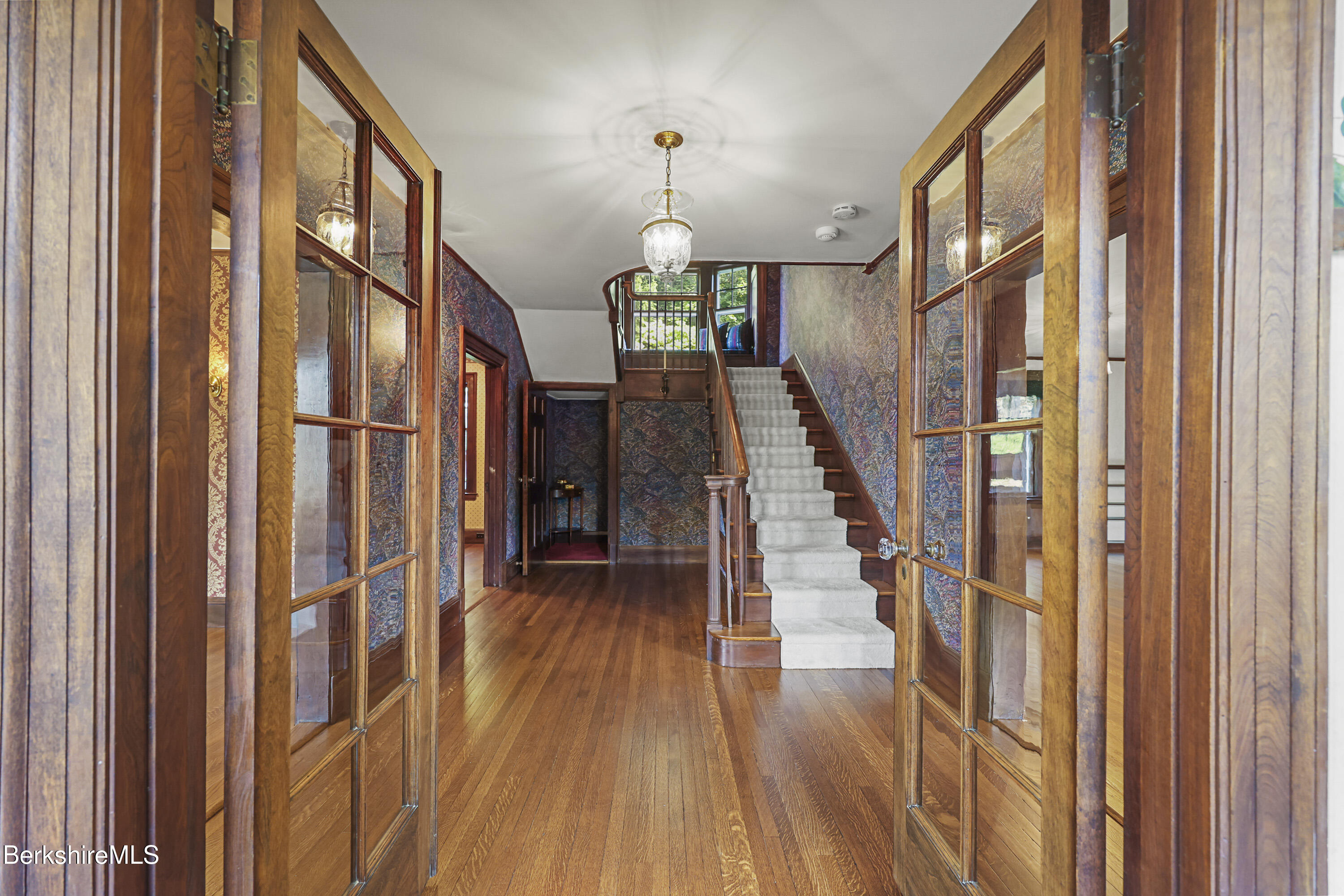 5 Crofut Street Pittsfield, MA 01201 - Photo 3 of 63 a view of staircase with wooden floor and fan