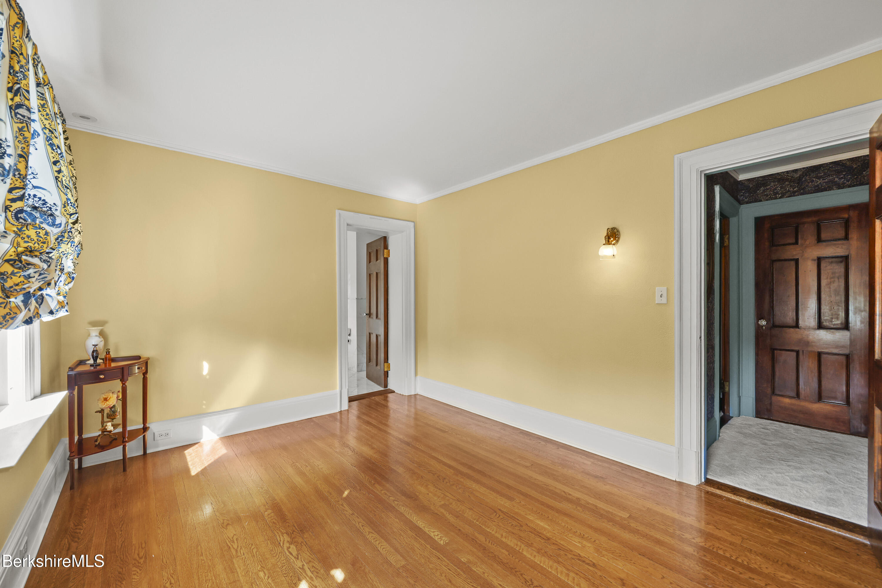 5 Crofut Street Pittsfield, MA 01201 - Photo 39 of 63 a view of an empty room with wooden floor and a window
