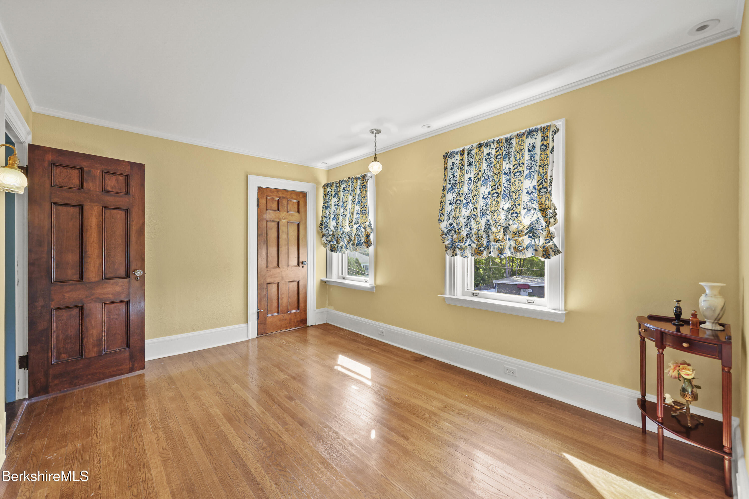 5 Crofut Street Pittsfield, MA 01201 - Photo 41 of 63 a view of an empty room with a window and wooden floor