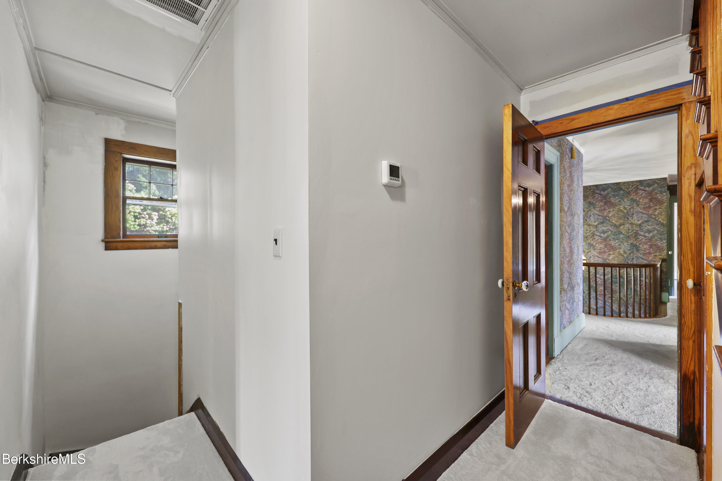 5 Crofut Street Pittsfield, MA 01201 - Photo 49 of 63 a view of a hallway with a glass door and a bathroom