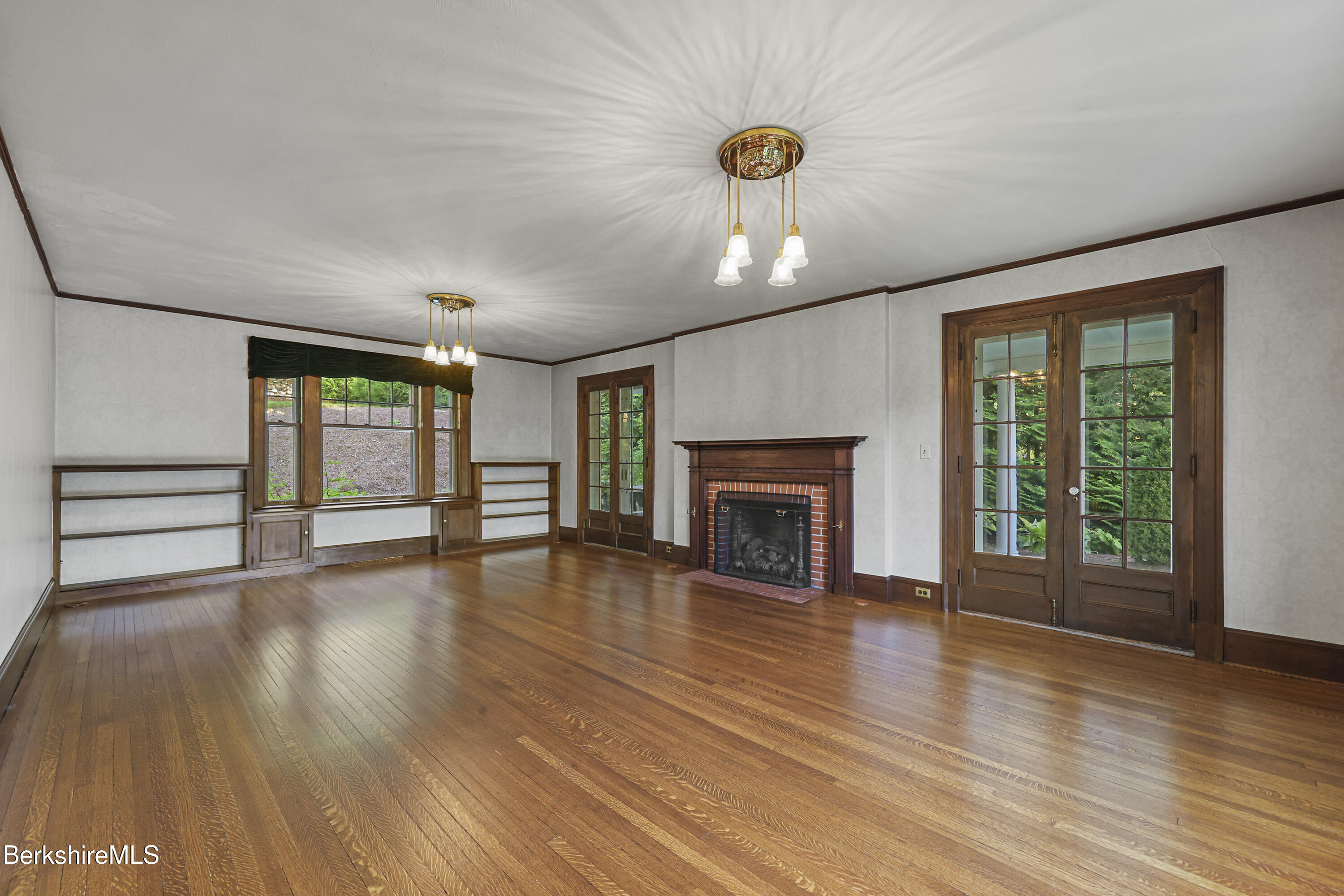 5 Crofut Street Pittsfield, MA 01201 - Photo 6 of 63 a view of an empty room with wooden floor and a window