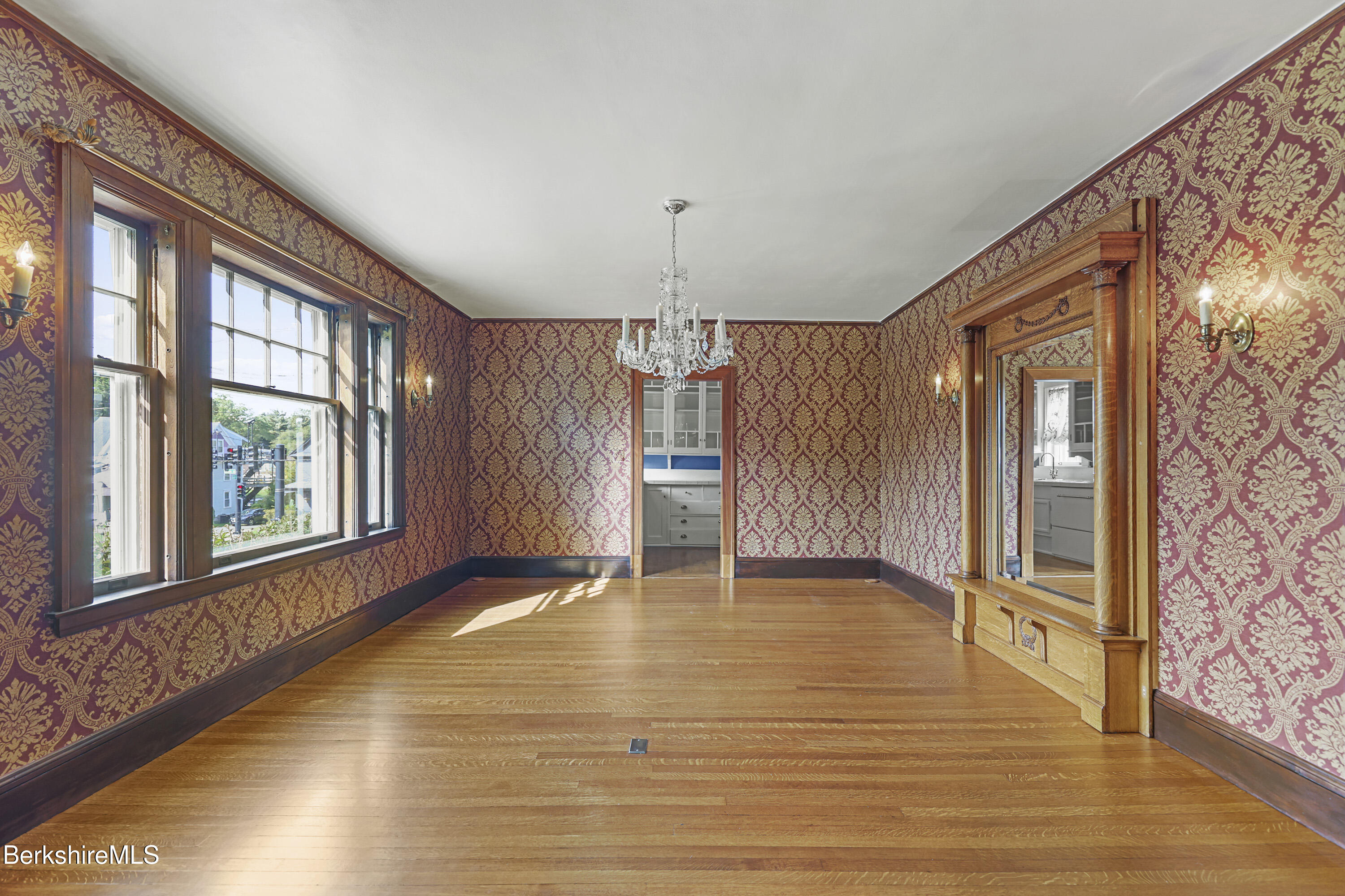 5 Crofut Street Pittsfield, MA 01201 - Photo 7 of 63 a view of an empty room with a window and wooden floor