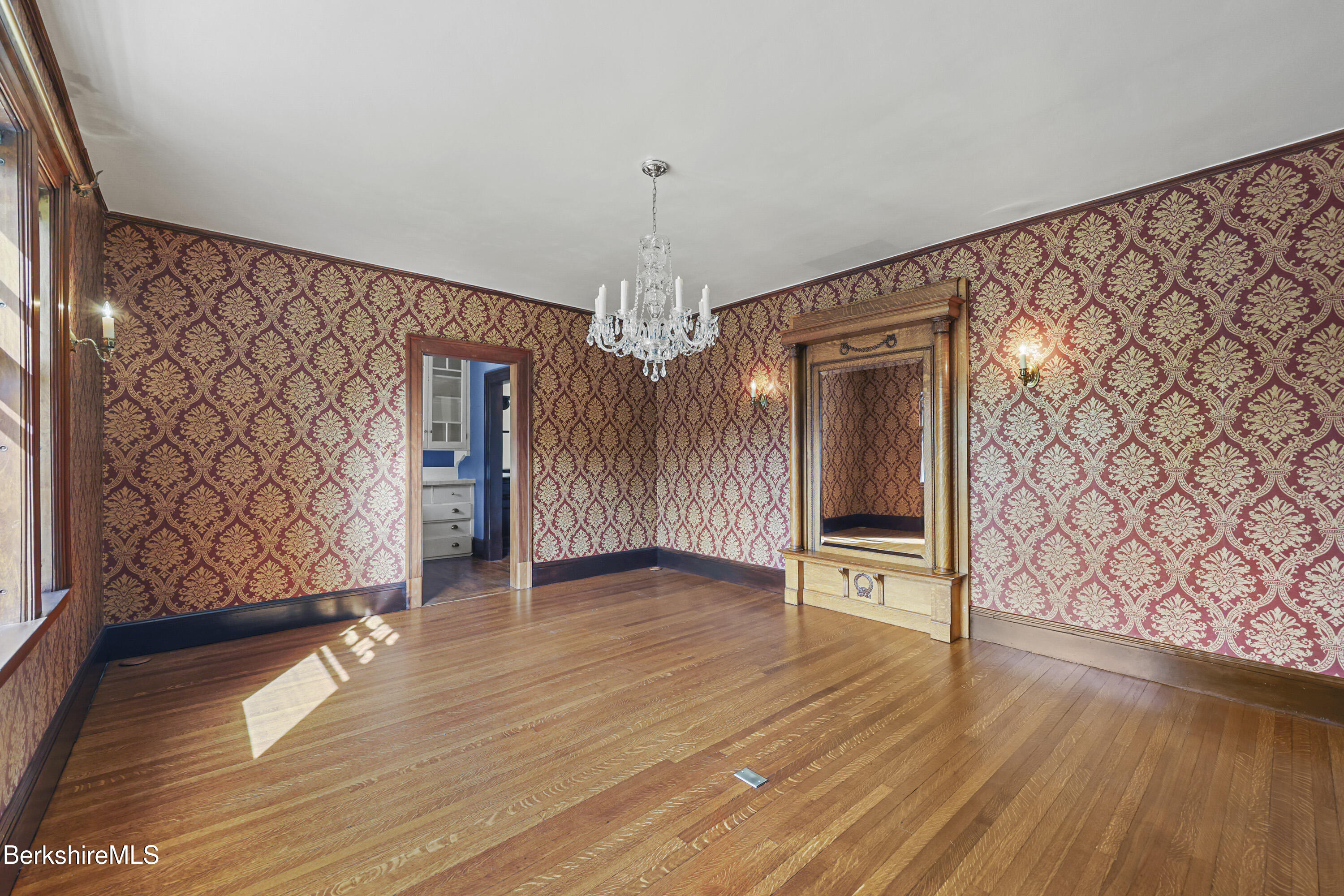 5 Crofut Street Pittsfield, MA 01201 - Photo 8 of 63 a view of an empty room with wooden floor and windows