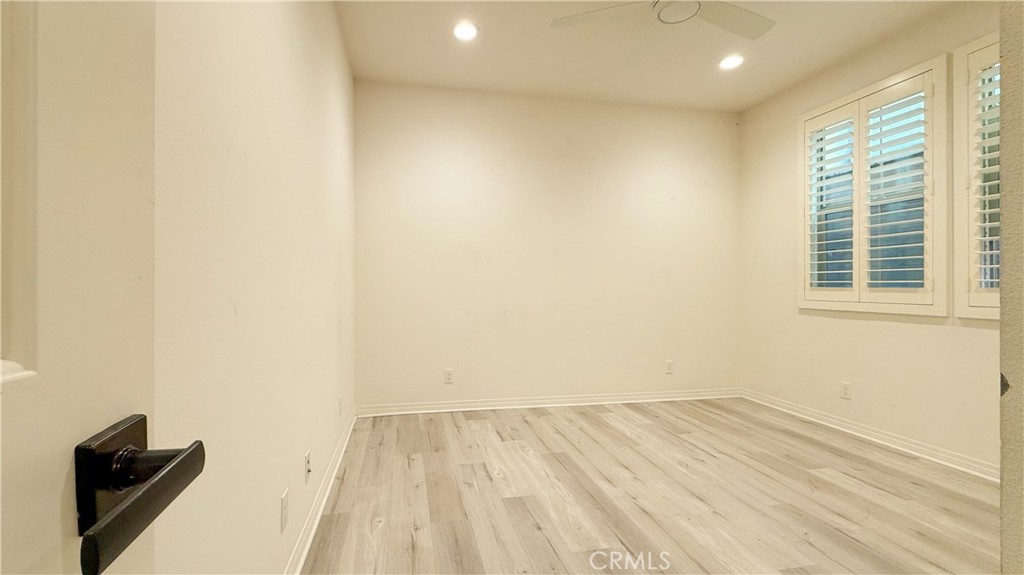 140 Hemisphere Irvine, CA 92618 - Photo 14 of 46 an empty room with wooden floor and windows