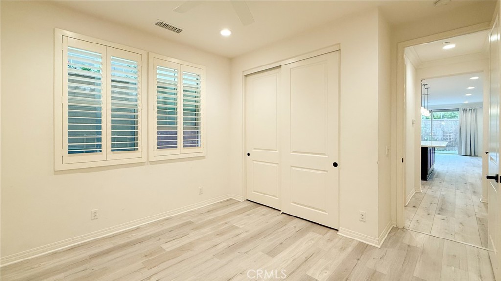 140 Hemisphere Irvine, CA 92618 - Photo 15 of 46 a view of an empty room with wooden floor and a window