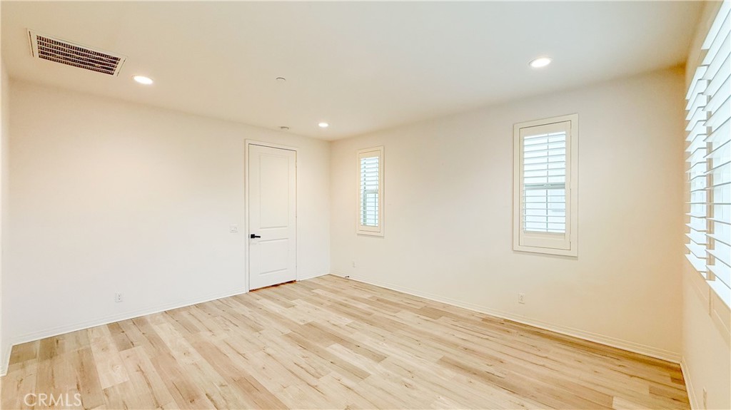 140 Hemisphere Irvine, CA 92618 - Photo 19 of 46 a view of empty room with wooden floor and fan