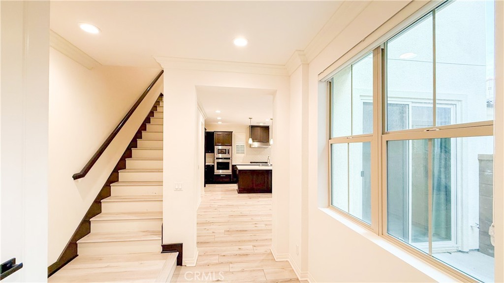 140 Hemisphere Irvine, CA 92618 - Photo 2 of 46 a view of a hallway with wooden floor and staircase
