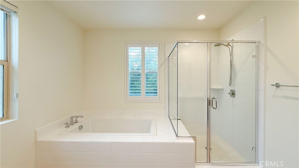 140 Hemisphere Irvine, CA 92618 - Photo 24 of 46 a bathroom with a bathtub and a shower