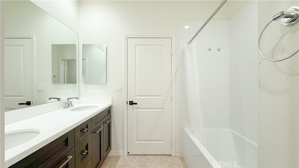 140 Hemisphere Irvine, CA 92618 - Photo 29 of 46 a bathroom with a tub sink and mirror