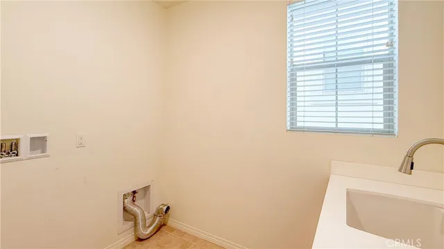 a bathroom with a sink and a window