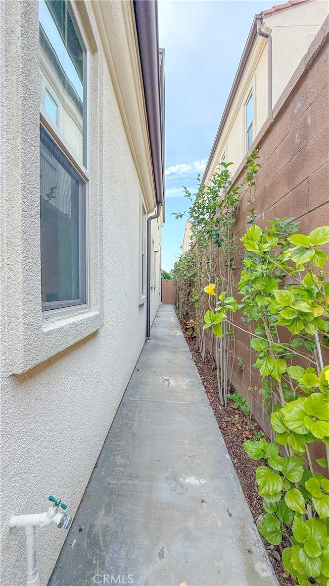 140 Hemisphere Irvine, CA 92618 - Photo 40 of 46 a view of a pathway of a house with flower plants