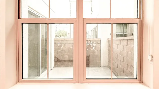 a view of a glass door and a window