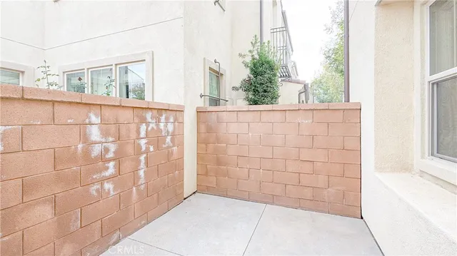 a view of a blue house with a window