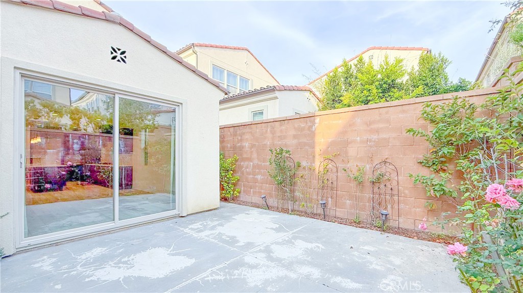 140 Hemisphere Irvine, CA 92618 - Photo 9 of 46 a view of a porch with furniture and front door