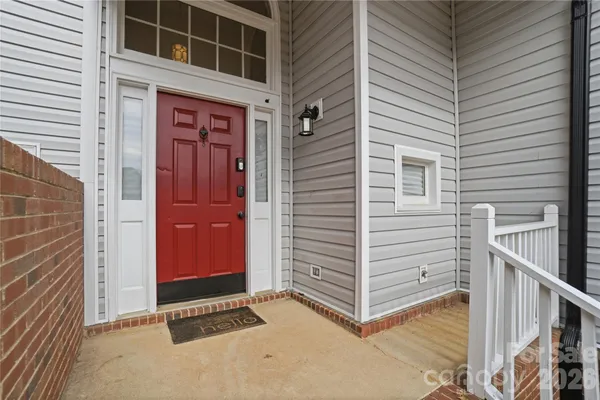 a view of front door and brick walls