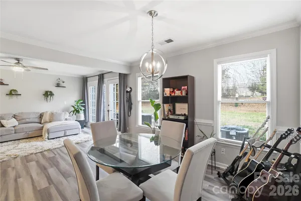 a view of a dining room with furniture window and outside view