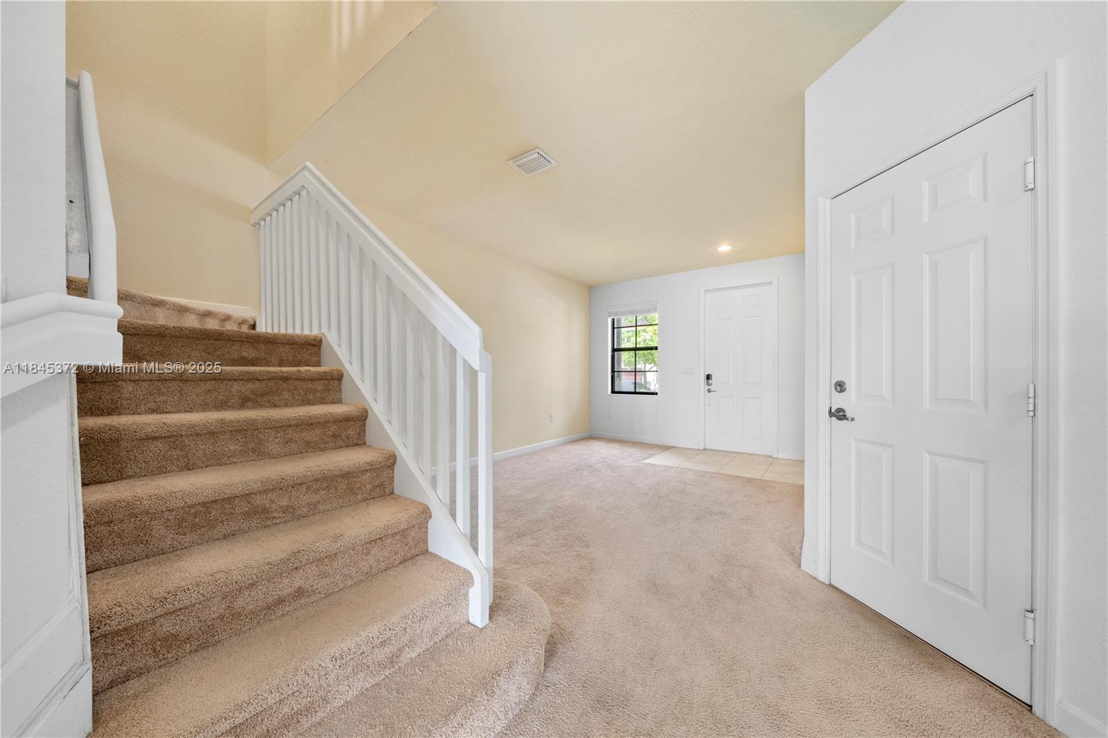 3366 West 90th Terrace, Unit 3366 Hialeah, FL 33018 - Photo 12 of 26 a view of an empty room with stairs
