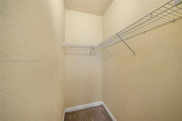 a view of small space with empty racks on the wall