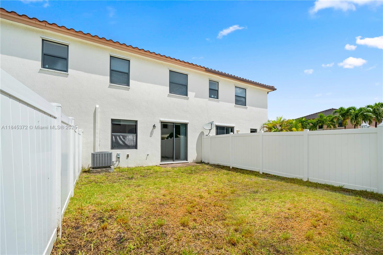 3366 West 90th Terrace, Unit 3366 Hialeah, FL 33018 - Photo 4 of 26 a view of house with backyard and tree