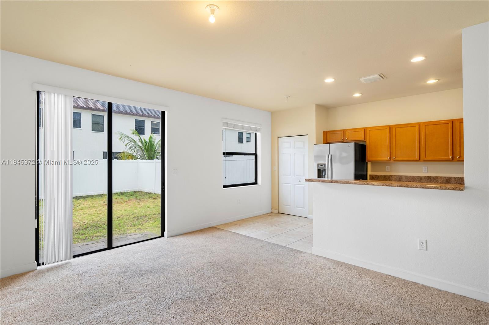 3366 West 90th Terrace, Unit 3366 Hialeah, FL 33018 - Photo 9 of 26 a view of a kitchen with a sink and a refrigerator
