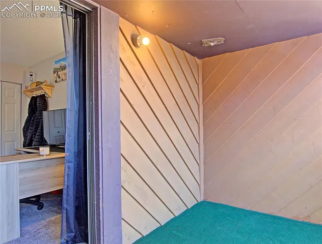 a view of front door and bedroom