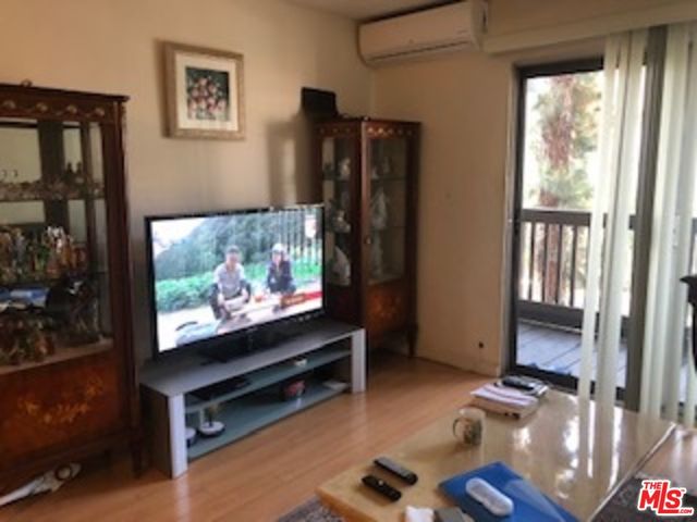 a room with furniture and flat screen tv