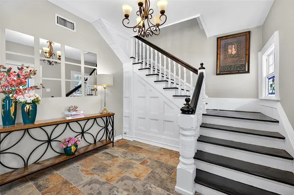 a bathroom with a sink toilet and a mirror