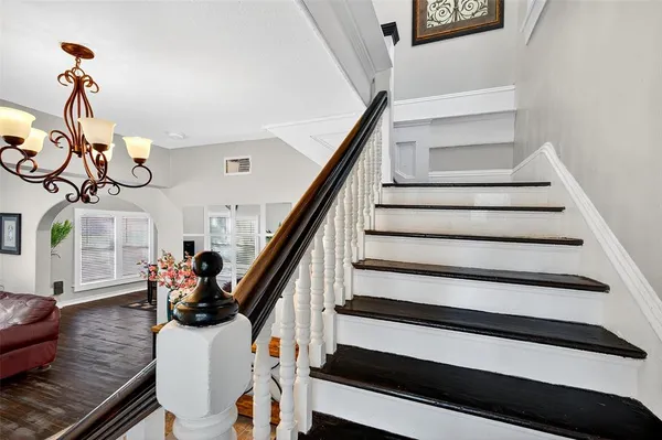 a view of an entryway with wooden floor