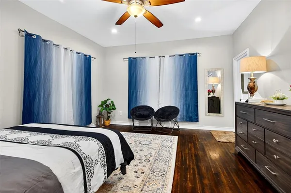 a bedroom with a bed and a television