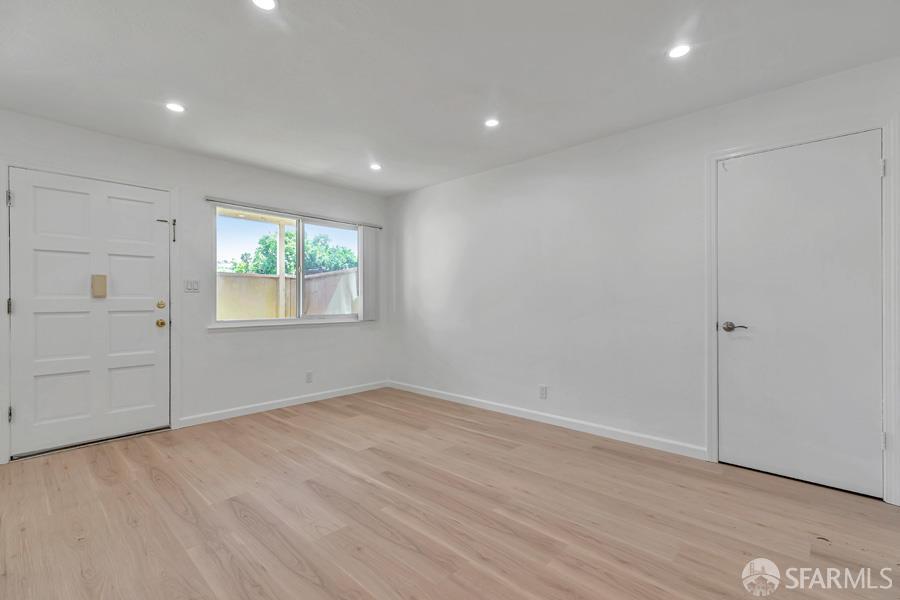 46728 Crawford Street, Unit 2 Fremont, CA 94539 - Photo 13 of 39 an empty room with wooden floor and windows