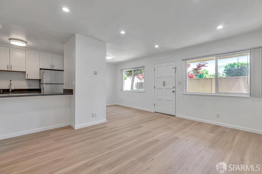 46728 Crawford Street, Unit 2 Fremont, CA 94539 - Photo 14 of 39 an empty room with wooden floor and windows