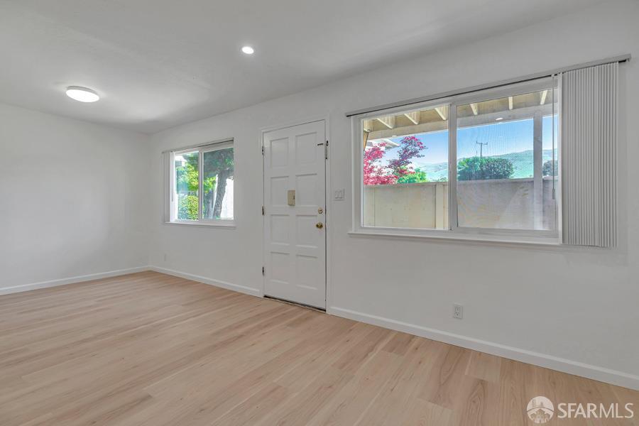 46728 Crawford Street, Unit 2 Fremont, CA 94539 - Photo 15 of 39 an empty room with wooden floor and windows