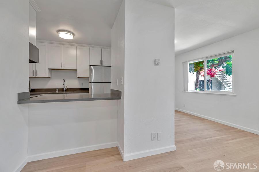 46728 Crawford Street, Unit 2 Fremont, CA 94539 - Photo 19 of 39 a living room with stainless steel appliances granite countertop a refrigerator and a stove top oven
