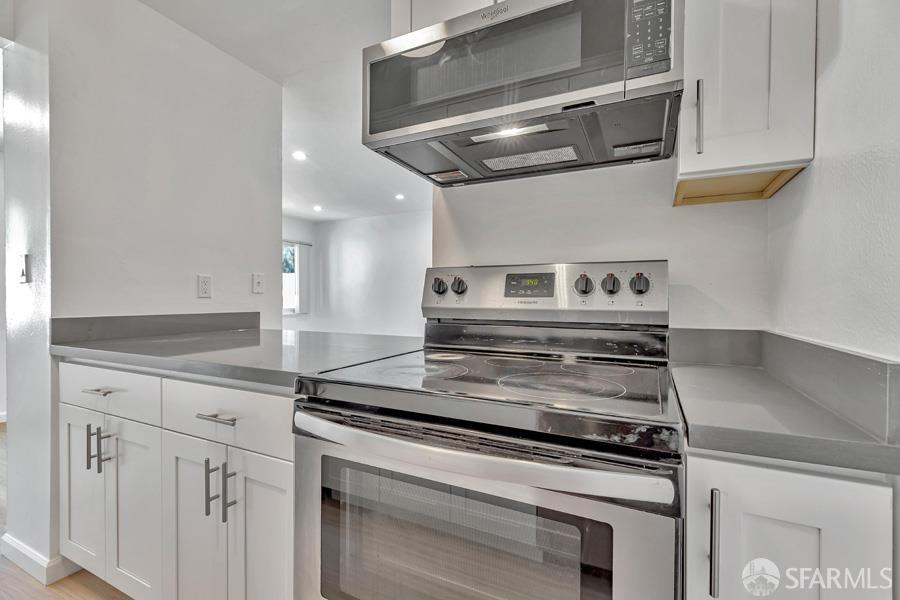 46728 Crawford Street, Unit 2 Fremont, CA 94539 - Photo 23 of 39 a stove top oven sitting inside of a kitchen