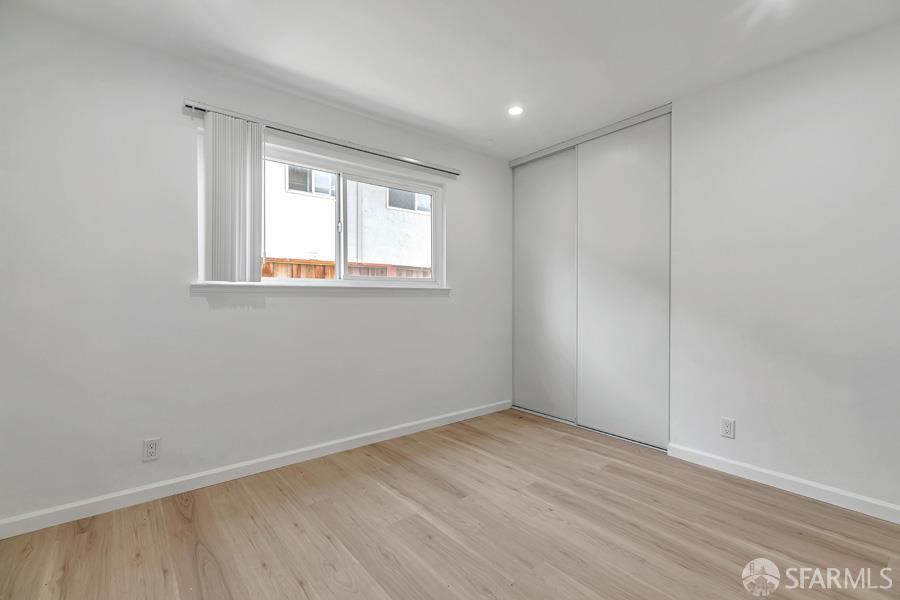 46728 Crawford Street, Unit 2 Fremont, CA 94539 - Photo 27 of 39 an empty room with wooden floor and windows