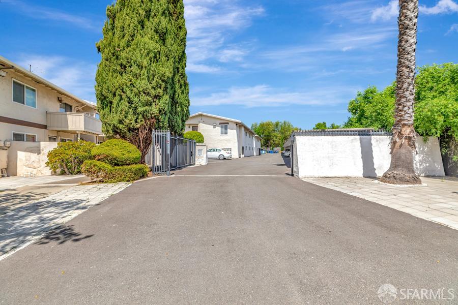 46728 Crawford Street, Unit 2 Fremont, CA 94539 - Photo 37 of 39 a view of a street with a building and a street sign
