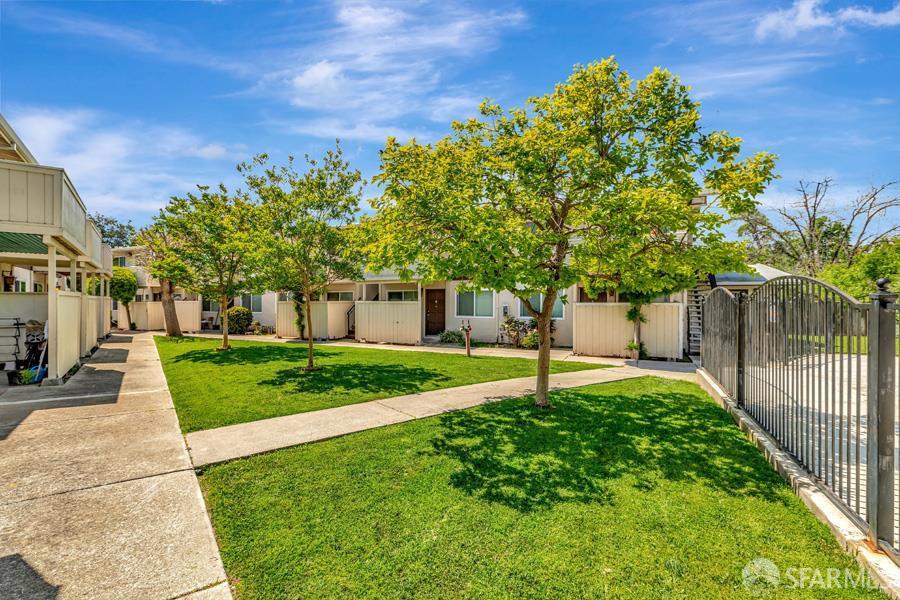 46728 Crawford Street, Unit 2 Fremont, CA 94539 - Photo 4 of 39 a house with green field in front of it