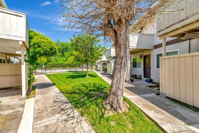a view of yard with patio