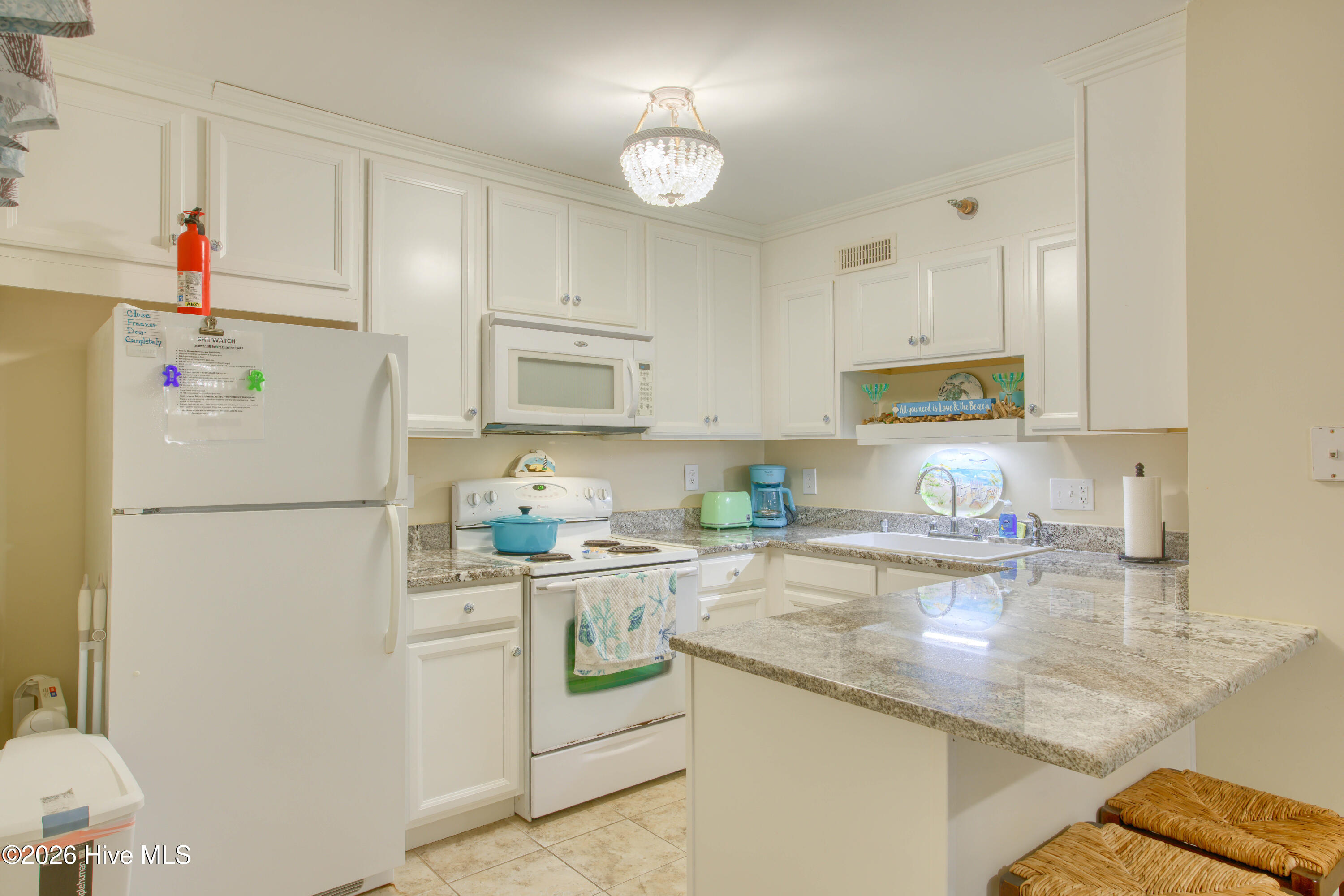 1896 New River Inlet Road, Unit 1209 North Topsail Beach, NC 28460 - Photo 6 of 38 Kitchen