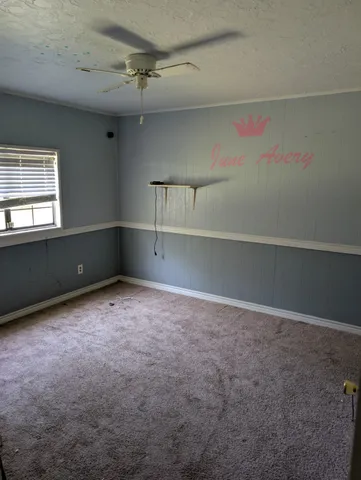 a view of an empty room with a closet