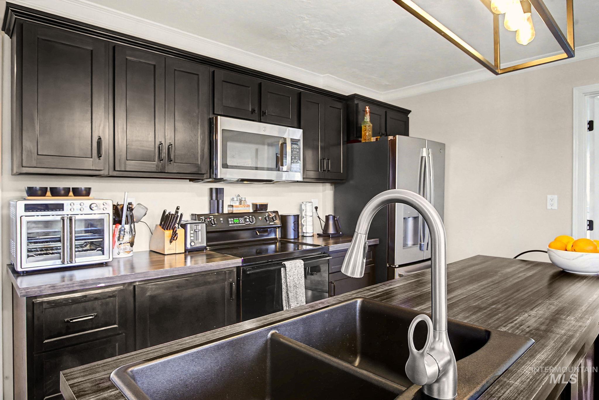 3312 5th Street Lewiston, ID 83501 - Photo 8 of 44 Kitchen with stainless steel appliances & dark cabinetry