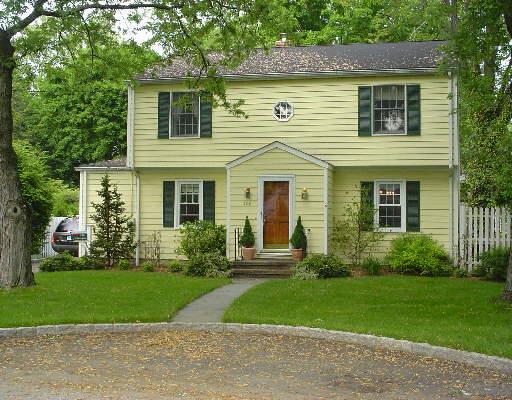 186 Dunnlea Road Fairfield, CT 06824 - Photo 1 of 1 front view of a house next to a yard