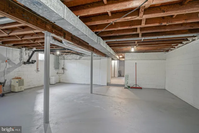 a view of empty room with wooden ceiling