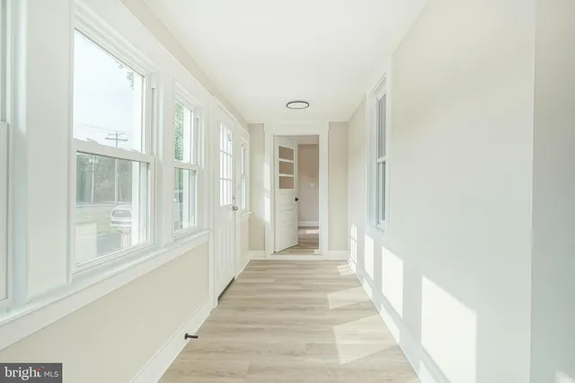 a view of a hallway with windows