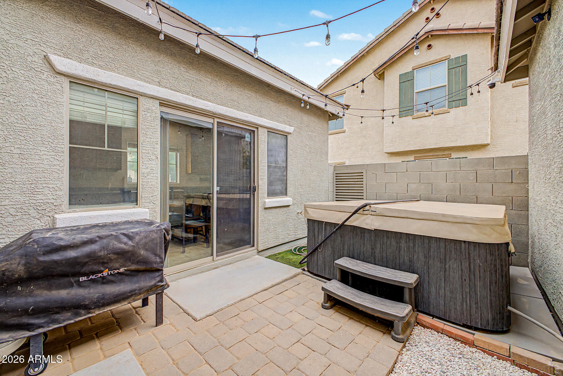 435 North Ranger Trail Gilbert, AZ 85234 - Photo 18 of 20 a backyard of a house with chairs and a table