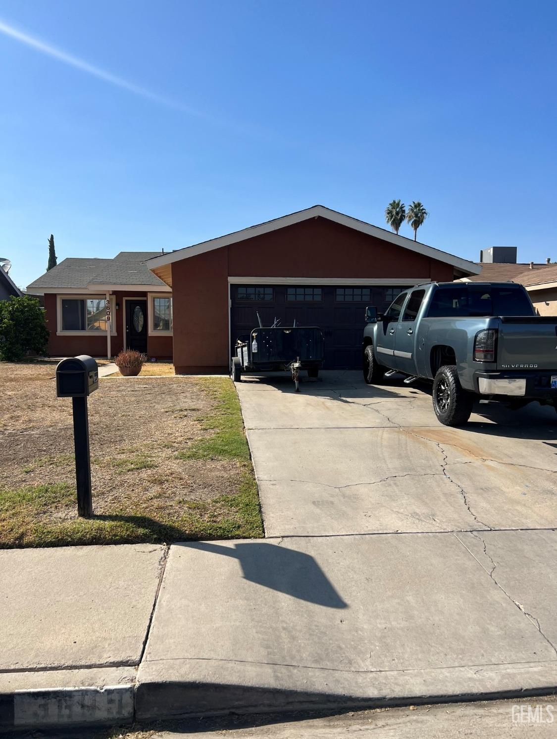 Undisclosed Address Bakersfield, CA 93309 - Photo 1 of 1 a front view of a house with yard