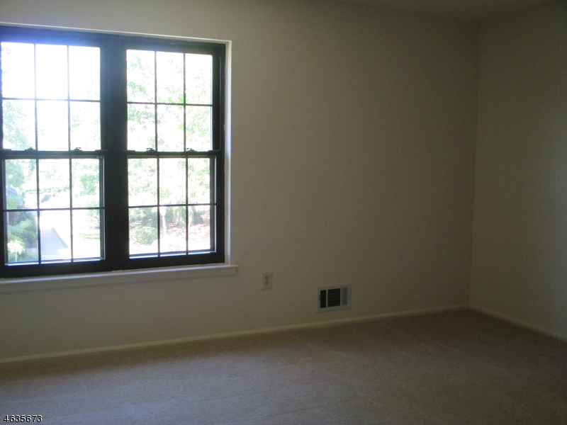 181 Long Hill Road, Unit K1 Little Falls, NJ 07424 - Photo 5 of 11 an empty room with a window