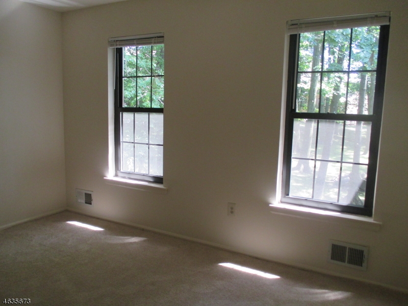 181 Long Hill Road, Unit K1 Little Falls, NJ 07424 - Photo 6 of 11 an empty room with a window